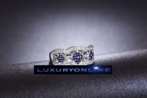 White Gold Filed Ring With 44 Simulated Diamonds And 12 Simulated Sapphires