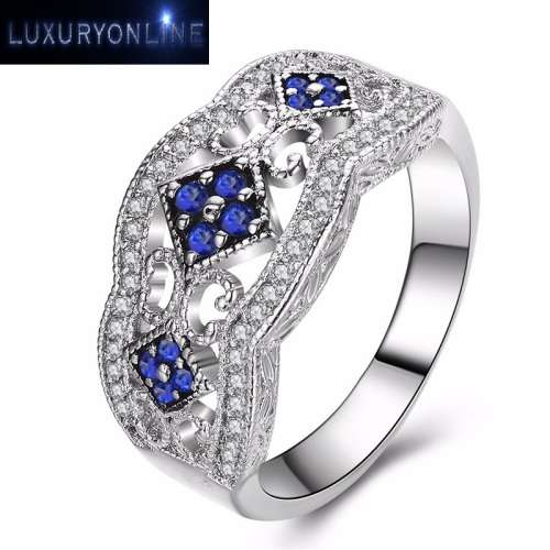 White Gold Filed Ring With 44 Simulated Diamonds And 12 Simulated Sapphires