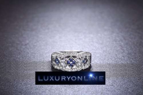 White Gold Filed Ring With 44 Simulated Diamonds And 12 Simulated Sapphires