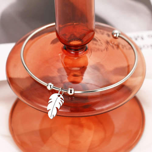 RETAIL PRICE: R 999 Adjustable Titanium "Whimsical Feather" Charm Bangle (SILVER)