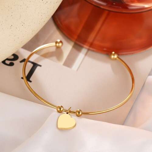 RETAIL PRICE: R 999 Adjustable Titanium "Heart" Charm Bangle (SILVER)