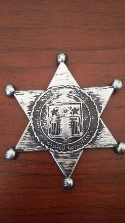 Silver plastic deputy sheriff badge was R7 now R5