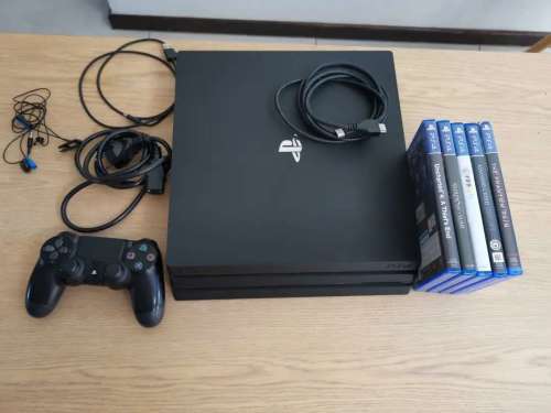 Playstation 4 pro (Ps4 pro) with 5 games.