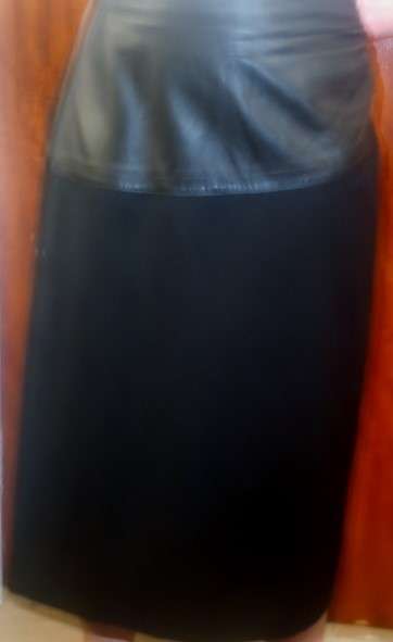 Miss Cassidy Pure New Wool Mid length skirt. Black with leather inset. Size 14