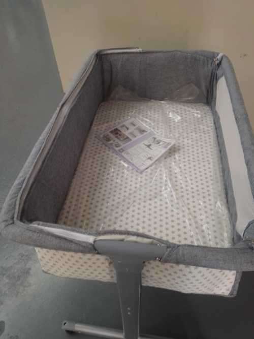 Gray and White Baby Bassinet