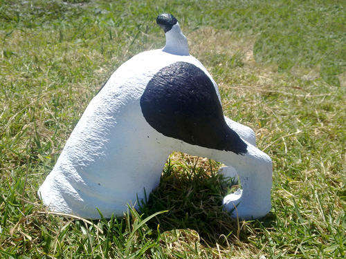 Cement Garden Ornament. Digging Dog. Black and White