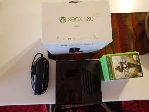 Almost brand new xbox 360 with 2 controllers and 10 games