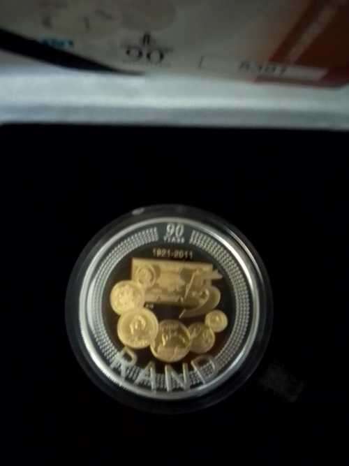 Mandela coins and gold leaflits