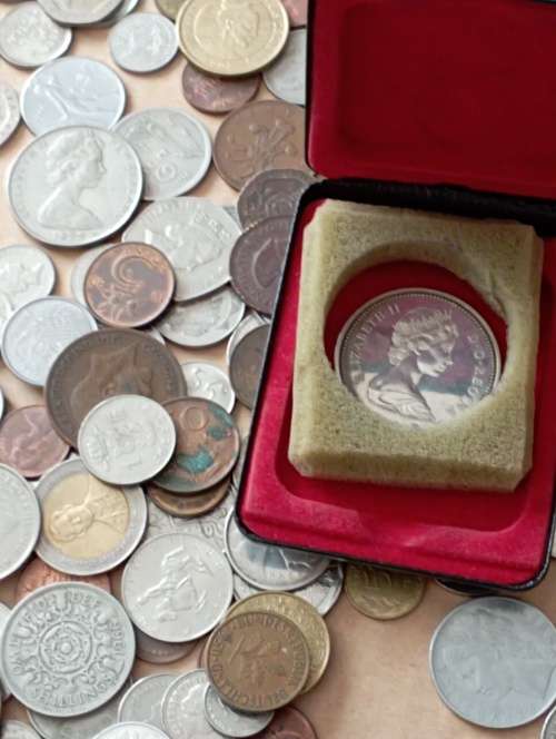 World Coins 200+ including Canadian silver dollar as per scan Shipping in description