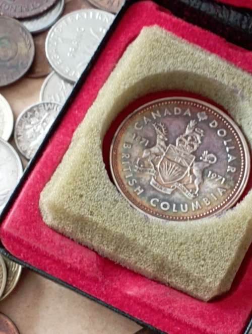 World Coins 200+ including Canadian silver dollar as per scan Shipping in description