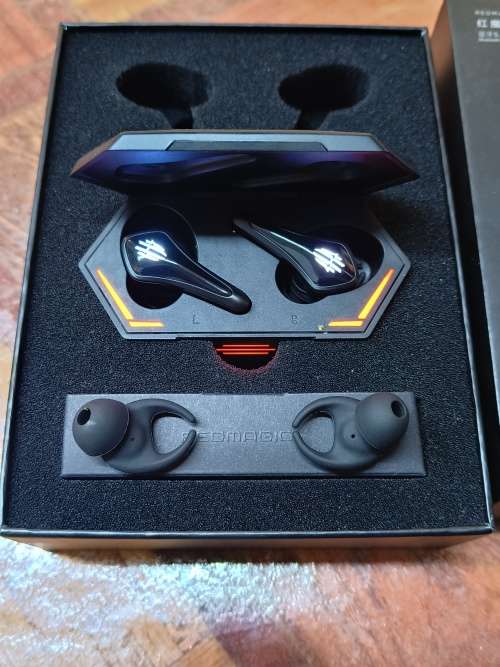 REDMAGIC TWS GAMING EARBUDS - BLACK WITH FLASHING RED LIGHTS.