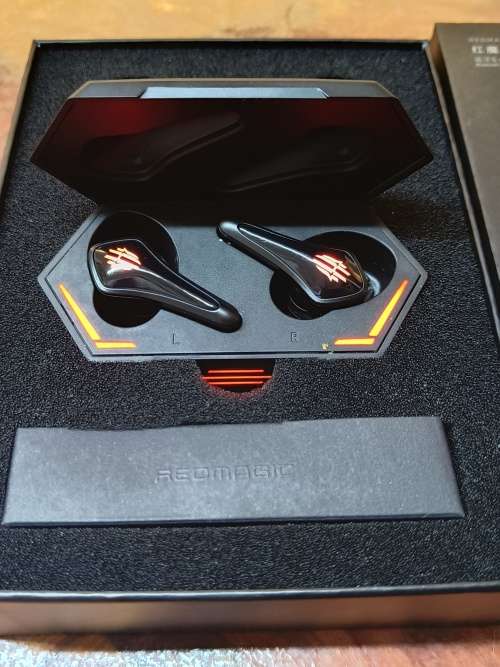 REDMAGIC TWS GAMING EARBUDS - BLACK WITH FLASHING RED LIGHTS.