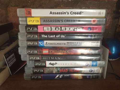 Playstation 3 w/ 2x remotes & games incl.