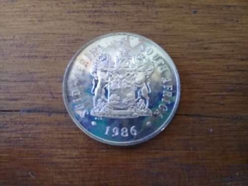 1986 Springbok Silver Rand Proof Coin. Rainbow toning