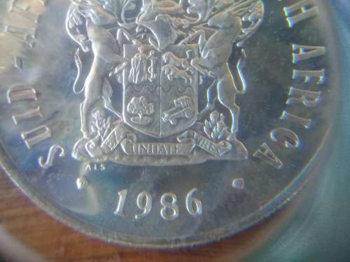 1986 Springbok Silver Rand Proof Coin. Rainbow toning