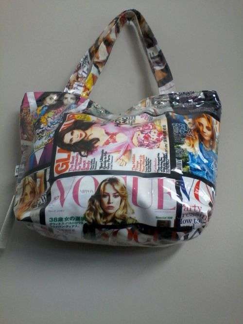 Plastic covered handbag with magazine print