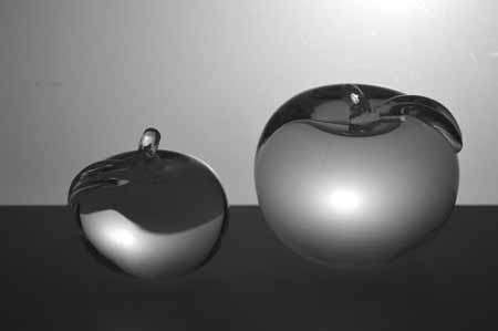 * SIMON PEARCE (IRISH-AMERICAN) TWO MAGNIFICENT PAPERWEIGHTS OF CLEAR GLASS, THE LARGER ONE SIGNED *