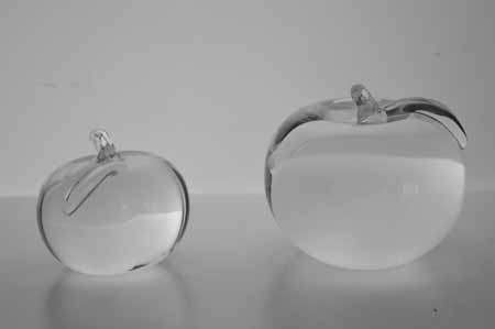 * SIMON PEARCE (IRISH-AMERICAN) TWO MAGNIFICENT PAPERWEIGHTS OF CLEAR GLASS, THE LARGER ONE SIGNED *