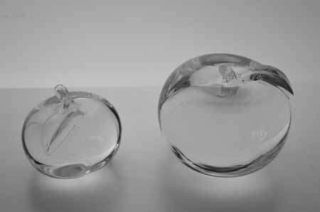 * SIMON PEARCE (IRISH-AMERICAN) TWO MAGNIFICENT PAPERWEIGHTS OF CLEAR GLASS, THE LARGER ONE SIGNED *