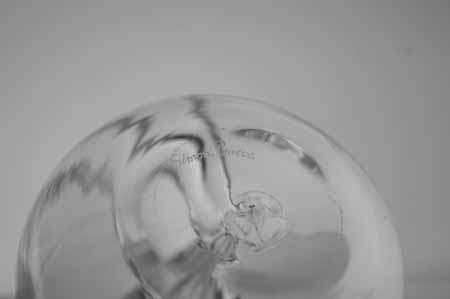 * SIMON PEARCE (IRISH-AMERICAN) TWO MAGNIFICENT PAPERWEIGHTS OF CLEAR GLASS, THE LARGER ONE SIGNED *