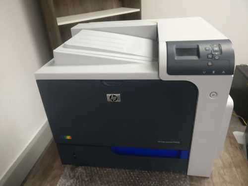HP Color LaserJet Enterprise CP4025dn with Paper Feeder and Cabinet (NO RESERVE)
