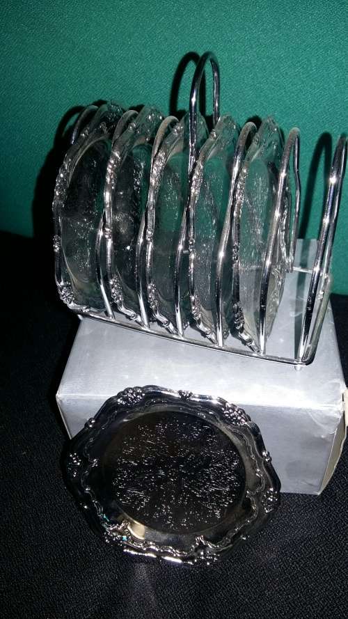 7 Piece Stainless Steel Coaster Set - 3 On Auction