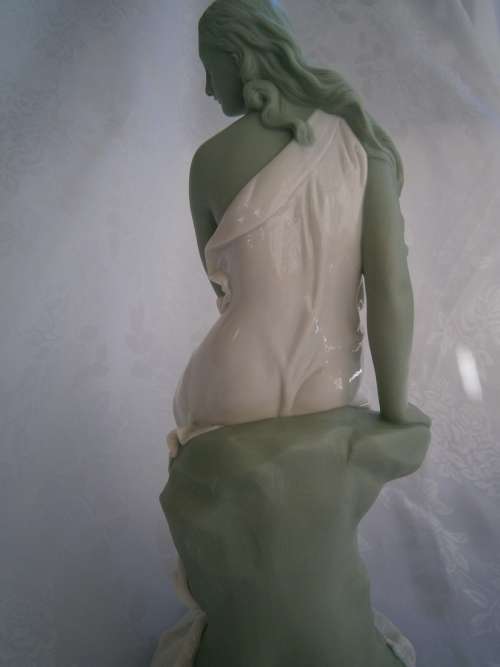 Minton part Glased and green tinted parian Figure  `MIiranda`, late 19th century