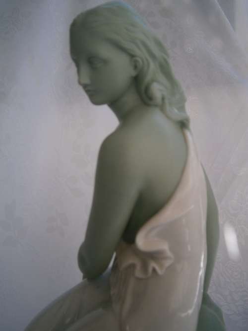 Minton part Glased and green tinted parian Figure  `MIiranda`, late 19th century