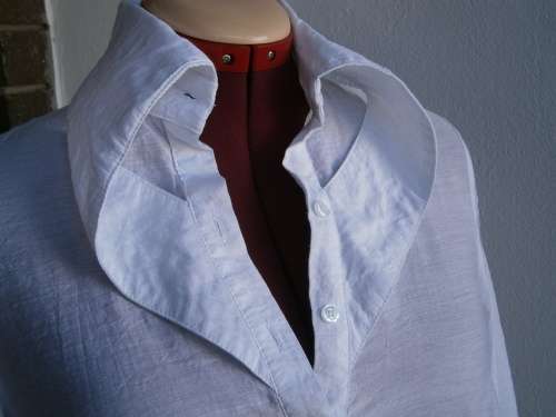 Stylish  long sleeve blouse with interesting collar  in size M