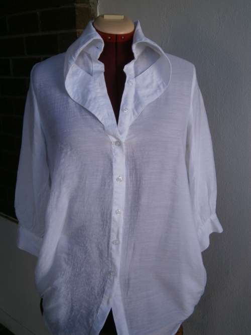 Stylish  long sleeve blouse with interesting collar  in size M