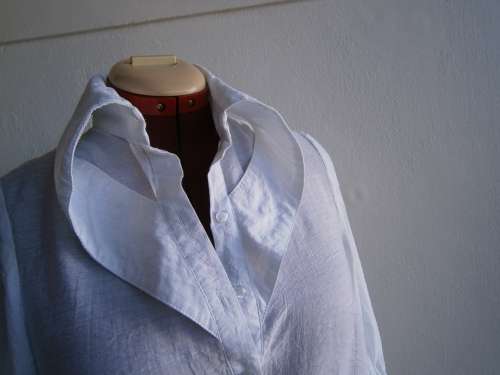 Stylish  long sleeve blouse with interesting collar  in size M