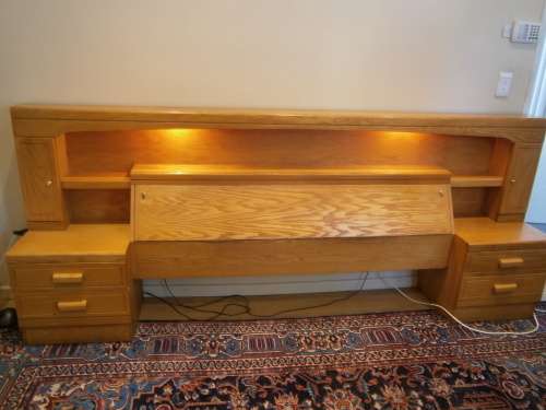Large Oak Headboard for queen size bed with two bedside tables and a compartment for beddings.