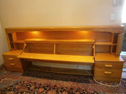 Large Oak Headboard for queen size bed with two bedside tables and a compartment for beddings.