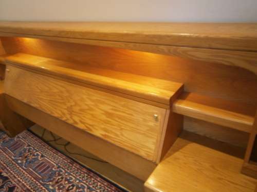Large Oak Headboard for queen size bed with two bedside tables and a compartment for beddings.