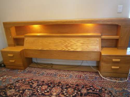 Large Oak Headboard for queen size bed with two bedside tables and a compartment for beddings.