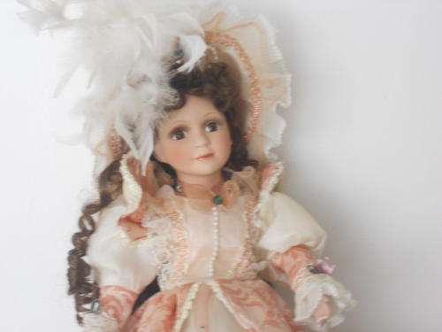Stunning porcelain doll with stand