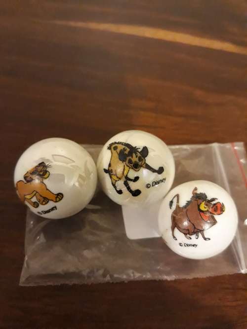 A Collection of 3 Lion King Marbles