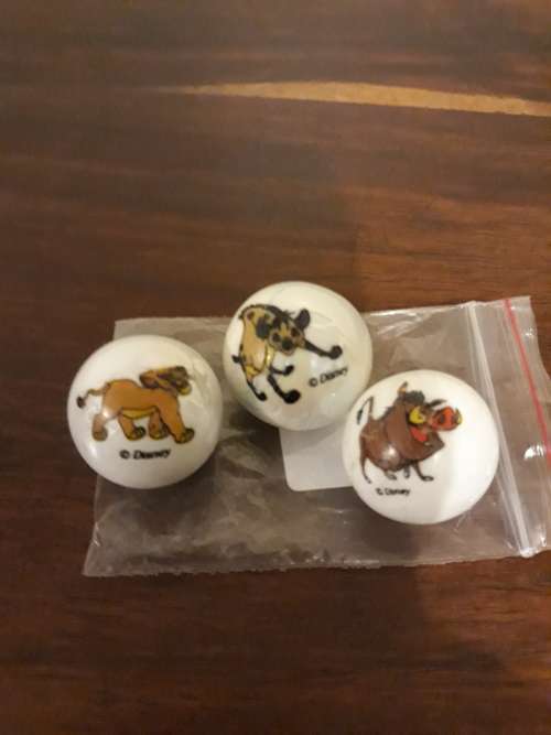 A Collection of 3 Lion King Marbles