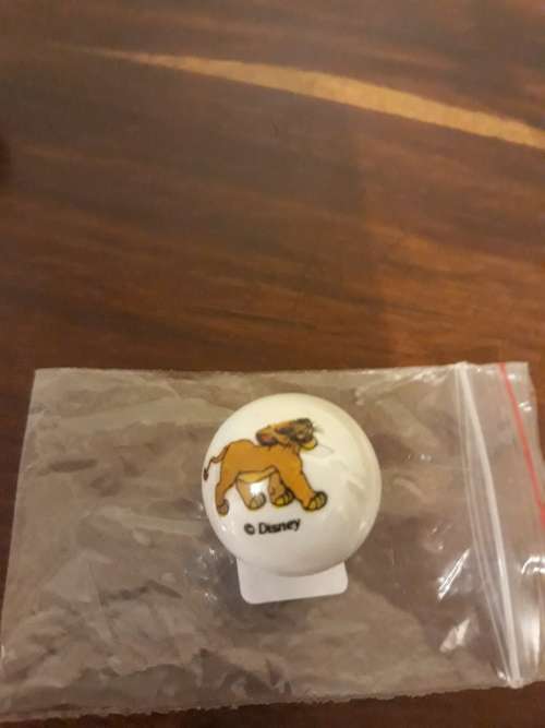 A Collection of 3 Lion King Marbles