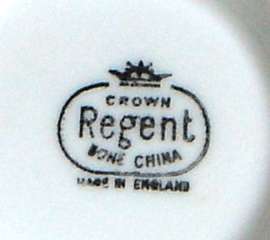 A place setting for five for tea, with Sugar Bowl and Milk Jug.  Crown Regent.