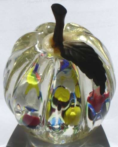 An unusual Glass Paper Weight with fluted sides.