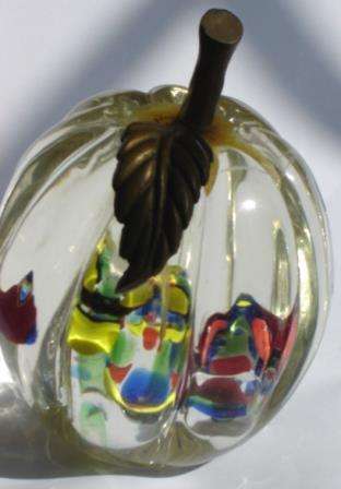 An unusual Glass Paper Weight with fluted sides.