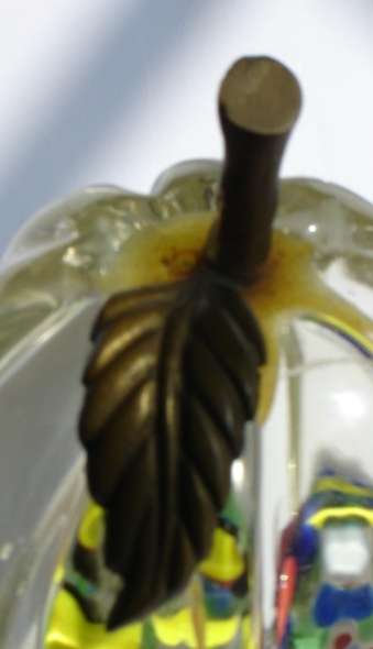 An unusual Glass Paper Weight with fluted sides.