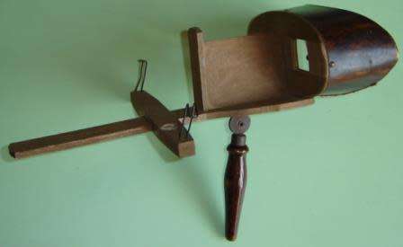 A stereo viewer with 15 photographs.