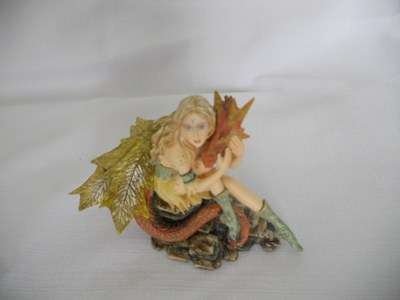 Fairy cuddling dragon