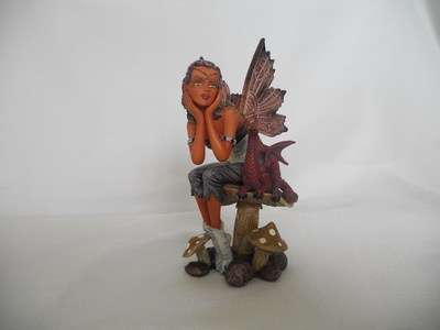 Fairy - Indian fairy sitting on toadstool with small dragon
