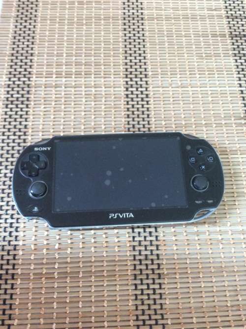 PS Vita (3G) with 2 games (Mortal Kombat & Wipeout) + 16 gig card