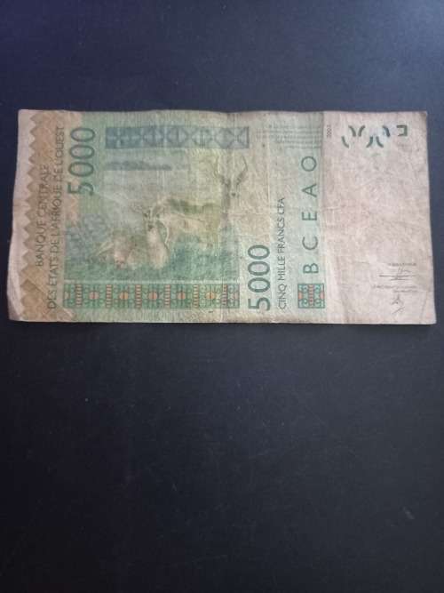 Central Africa 5000 Francs. Scarcer, but condition is in well curculated and used condition.
