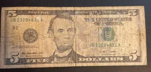 USA 5 dollar note. Well used