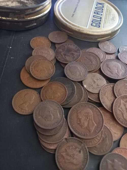 Tin with over 60 Great Britain pennies and half pennies